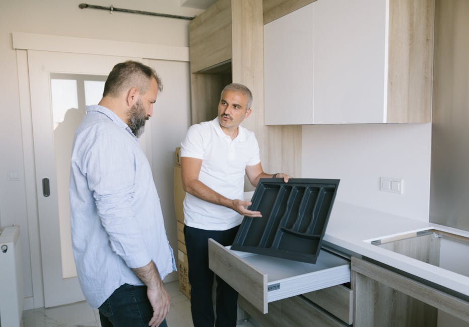 Contractor installing custom kitchen cabinets